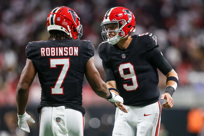 Atlanta Falcons running back Bijan Robinson (7) celebrates after a touchdown with quarterback Desmond Ridder (9) against the New Orleans Saints in the second quarter at Mercedes-Benz Stadium.
